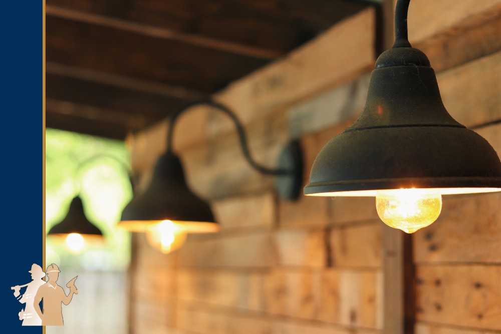 Warm, glowing lights hang on a rustic wooden wall, creating a cozy outdoor atmosphere, perfect for custom decks and outdoor living in Chesapeake, Virginia Beach, and Norfolk.| First In Decks and Fencing | Virginia Beach Deck Builders